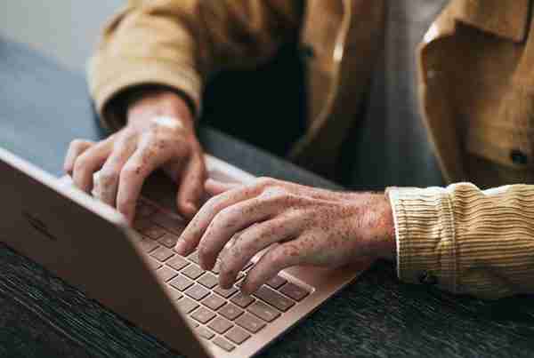 a person typing on a laptop